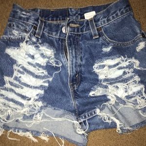 Ripped blue jean shorts